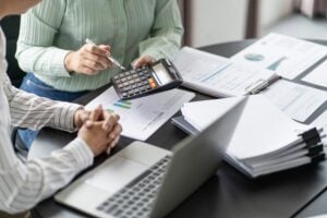 “Financial advisors reviewing business earnings and distributions.”